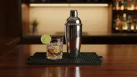Cocktail shaker on a rubber bar mat