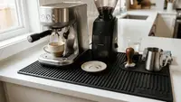 Bar mat under an espresso machine at a coffee station